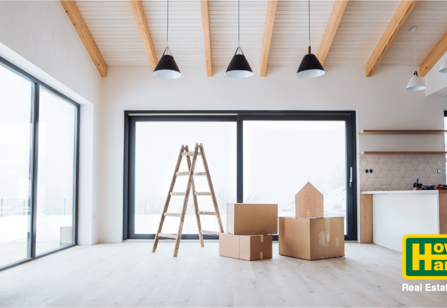 am empty house with boxes and a ladder